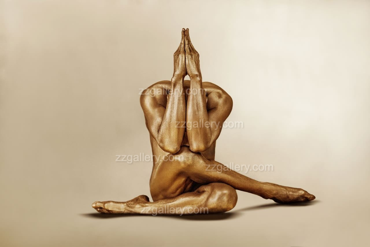 Gold-painted figure in prayer pose, sacred devotion fine art photography by Zack Zublena