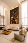 Sacred Silence fine art photograph by Zack Zublena displayed as large golden wall art in a modern living room with neutral décor.