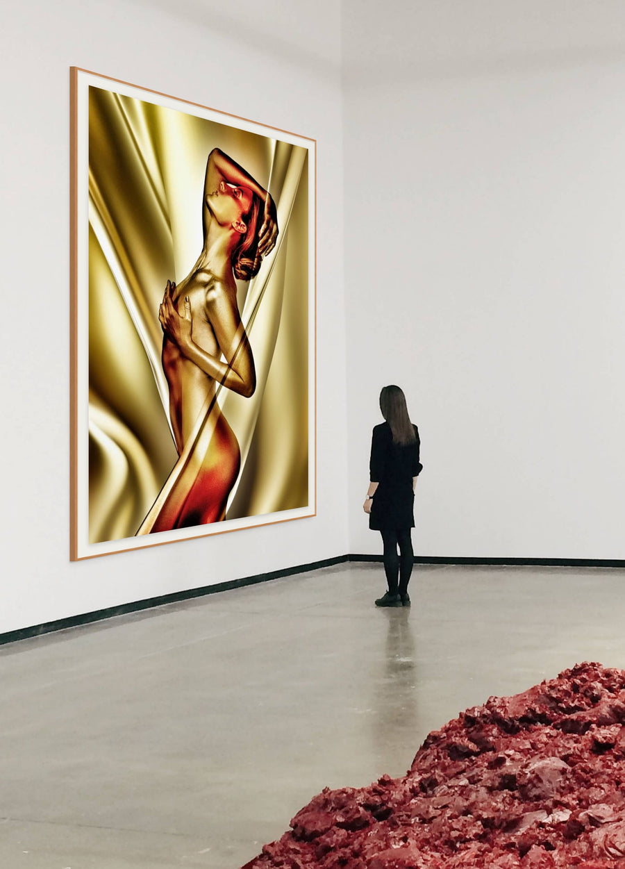 Surreal golden nude fine art photography by Zack Zublena, featuring a radiant female figure wrapped in flowing golden silk textures. Modern sensual wall art for spas, galleries, and luxury interiors.