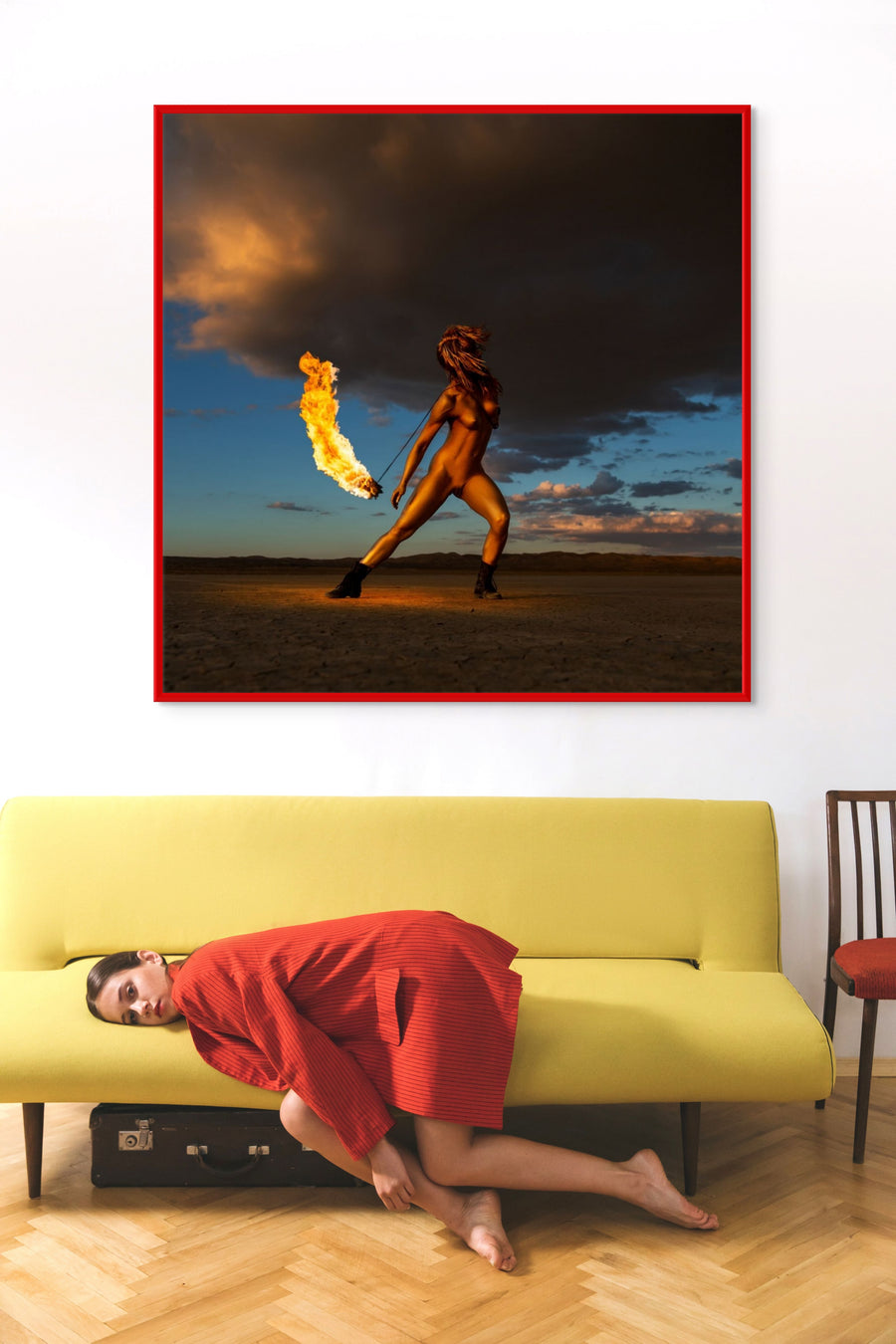 Square fine art photograph by Zack Zublena from the Skyfall Flames collection, showing a golden-painted figure dancing with real fire against a dramatic desert sky.
