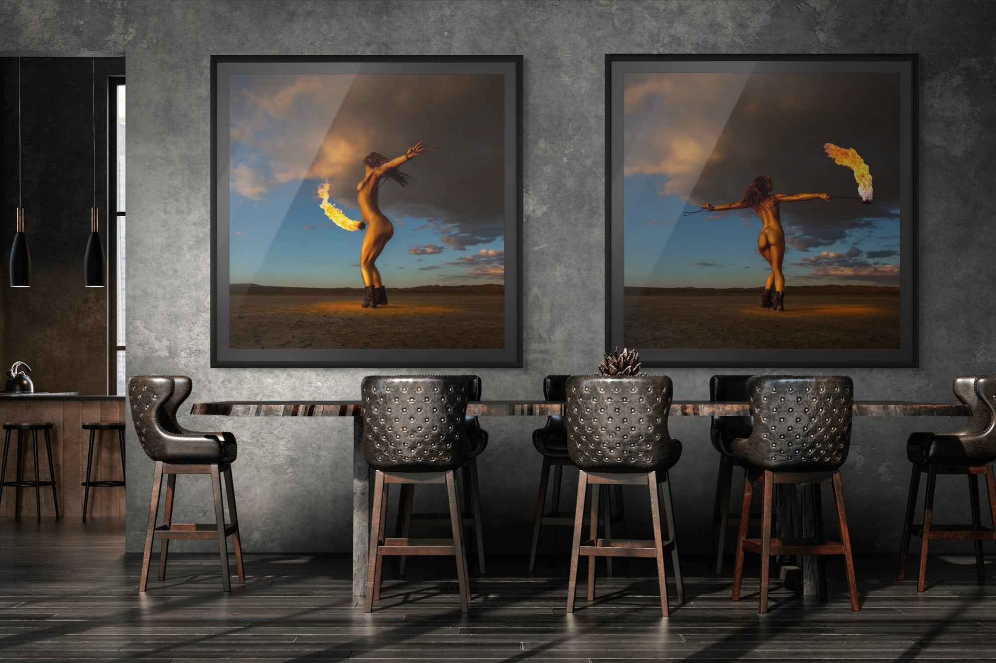 Diptych display of two framed fine art photographs from the Skyfall Flames VI – Phoenix Ascent series, featuring a gold-painted woman with fire in a desert setting, showcased in a modern dining interior.
