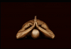 Gold-painted male figure bowing in prayer, luxury Catholic fine art wall decor with dark background by Zack Zublena