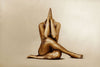 Gold-painted woman seated with hands in prayer pose, elegant spiritual wall art for yoga rooms, spas, and sacred interiors