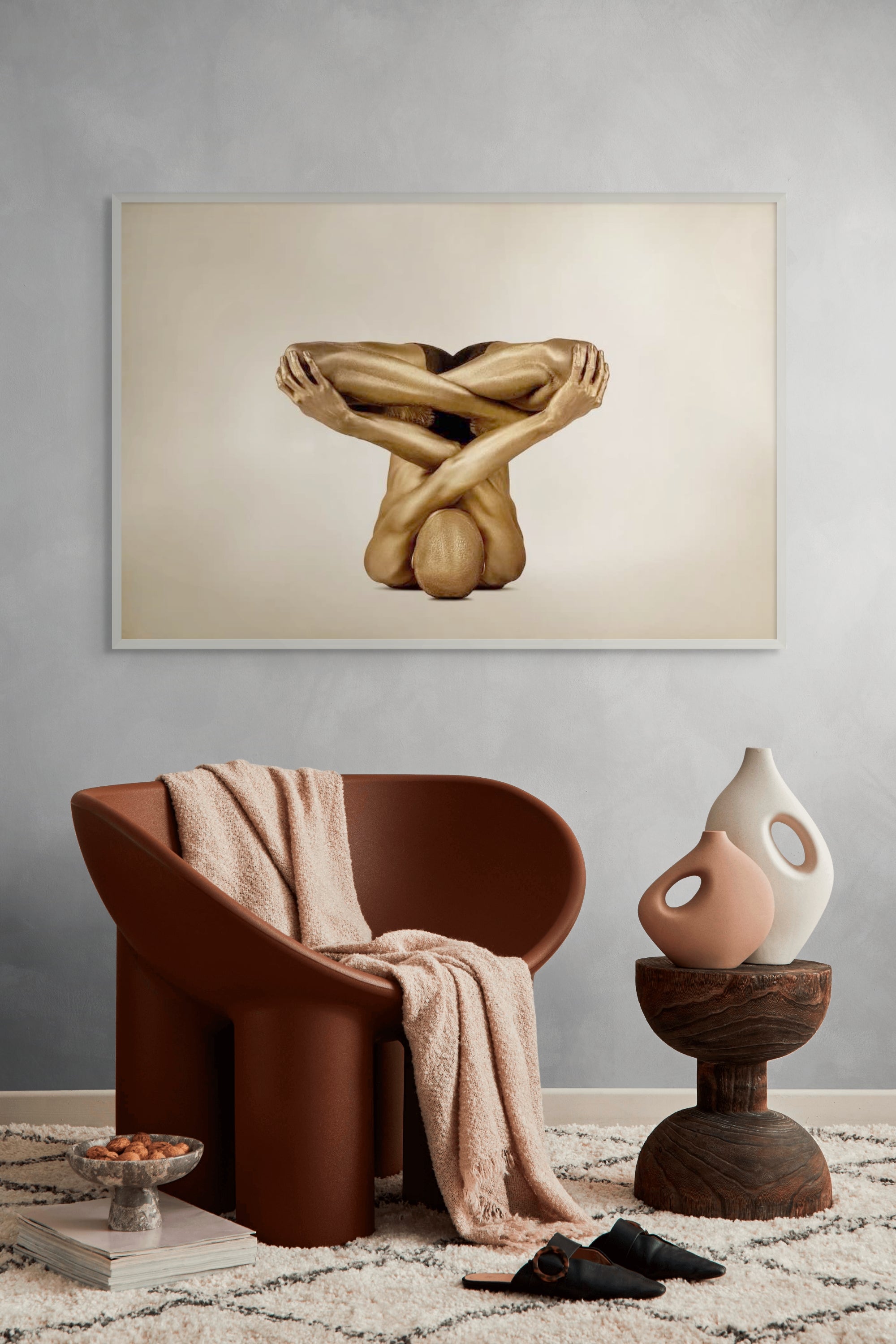 Golden-painted figure folded into a meditative pose with crossed arms and legs, part of Zack Zublena’s Vacuum State fine art photography collection.