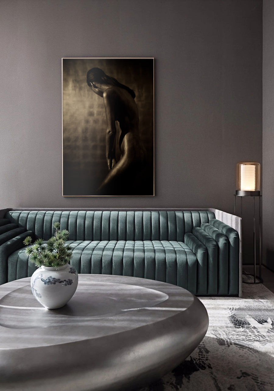 Elegant golden-painted silhouette of a woman with bowed head, fine art photography highlighting feminine grace, strength, and luxury wall decor