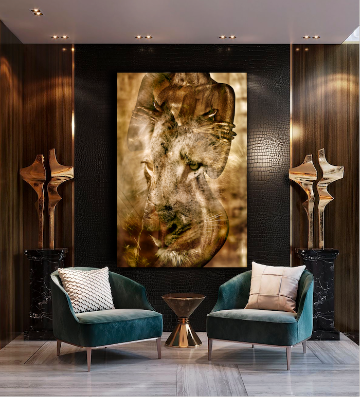 Golden-painted nude female figure blended with the face of a lion, symbolic fine art photography representing divine feminine power and animal spirit connection.